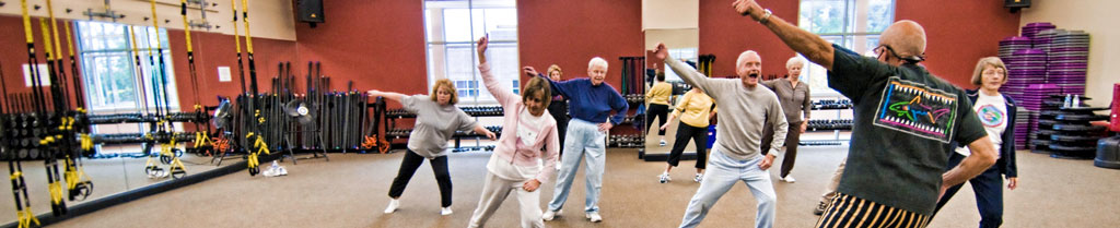 Group class doing calisthenics at Lexington Medical Center's Health Directions Wellness Gym.